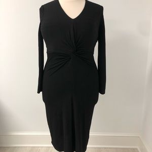 A black calve length dress with a knot